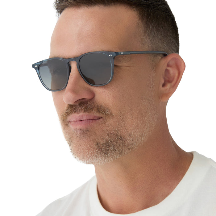 on model - male wearing diff eyewear maxwell square sunglasses with a blue night sky frame and grey gradient polarized lens angled view