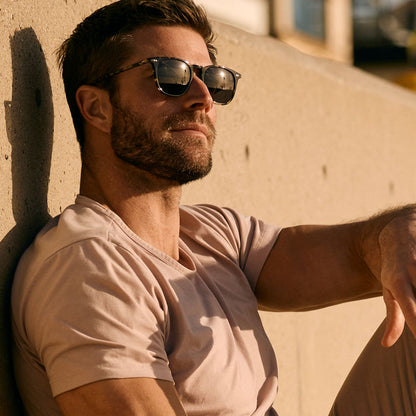 lifestyle - male wearing (davey fisher) diff eyewear maxwell xl square sunglasses with a espresso tortoise frame and grey polarized lenses angled view