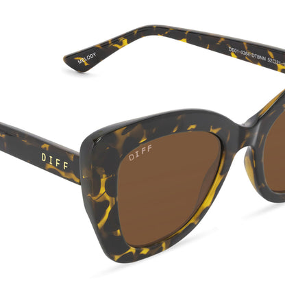 diff eyewear melody cat eye sunglasses with a dark tortoise frame and brown lenses detailed view