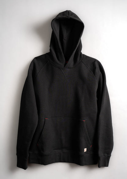 A black hoodie with a front pocket and red stitching details is displayed against a plain white background.