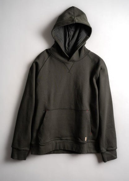 A dark green hoodie with a front pocket and hood, displayed on a plain white background, highlighting its casual style.