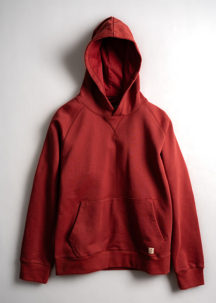 Red hoodie with a front pocket and hood, displayed against a plain white background. Simple and casual design.