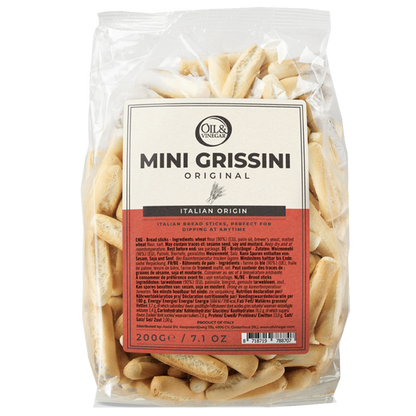Packaged mini grissini breadsticks in a clear plastic bag with branding and product information displayed on a label.
