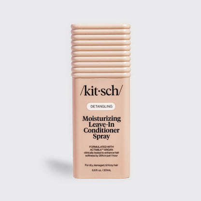 Kitsch Moisturizing Leave-In Conditioner Spray in blush packaging for dry, damaged, and frizzy hair, formulated with Actimilk™ Argan.