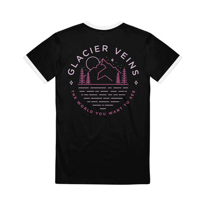 Back of black short sleeve shirt with GLACIER VEINS written across the top. Below the text is a drawing of a mountain with a moon over it and stars in the sky. there are pine trees at the base of the mountain. Below the drawing is pink text that says THE WORLD YOU WANT TO SEE.