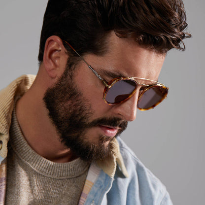 lifestyle - male model wearing star wars x diff eyewear obi-wan sunglasses with a desert tortoise frame and brown polarized lenses