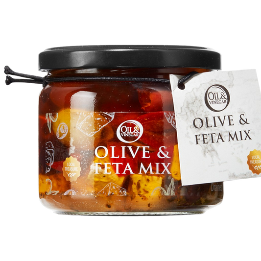A jar of Olive & Feta Mix, showing green and black olives along with pieces of feta cheese, marinated in oil.