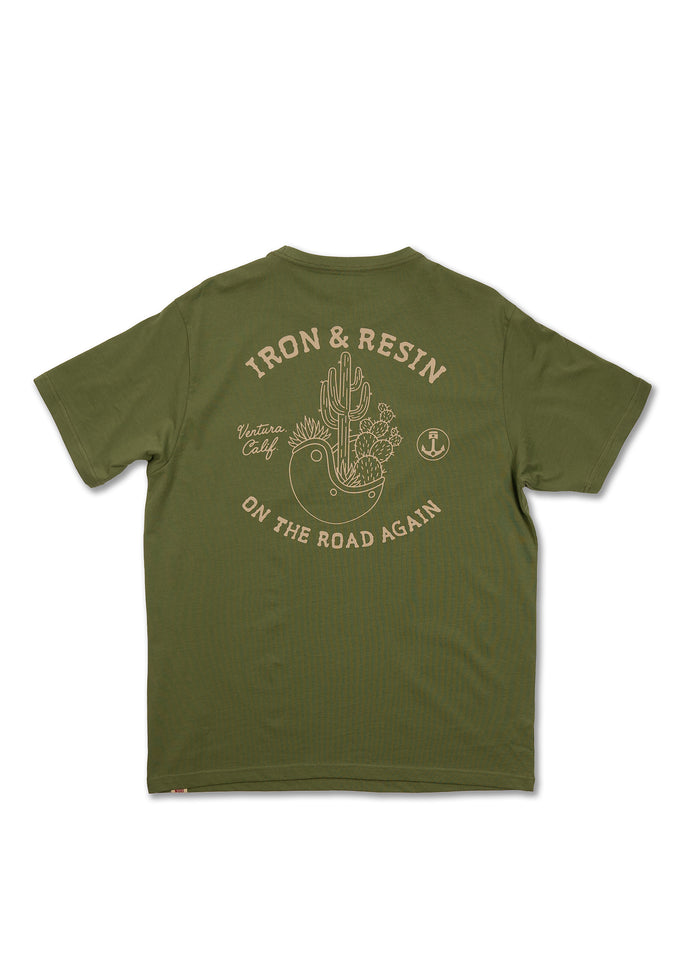 Green T-shirt with "Iron & Resin" and "On the Road Again" text, featuring a cactus and bird design. Ventura, Calif. style.