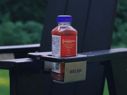 A gif of the Outrig cupholder with drinks in various shapes and sizes