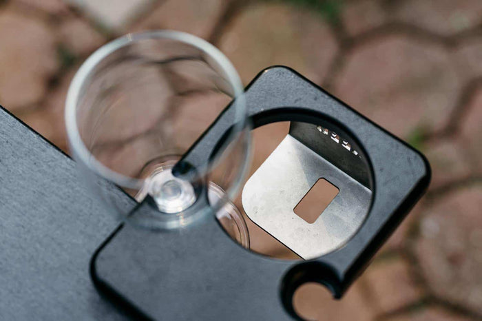 An image of an outrig cupholder holding a wine glass