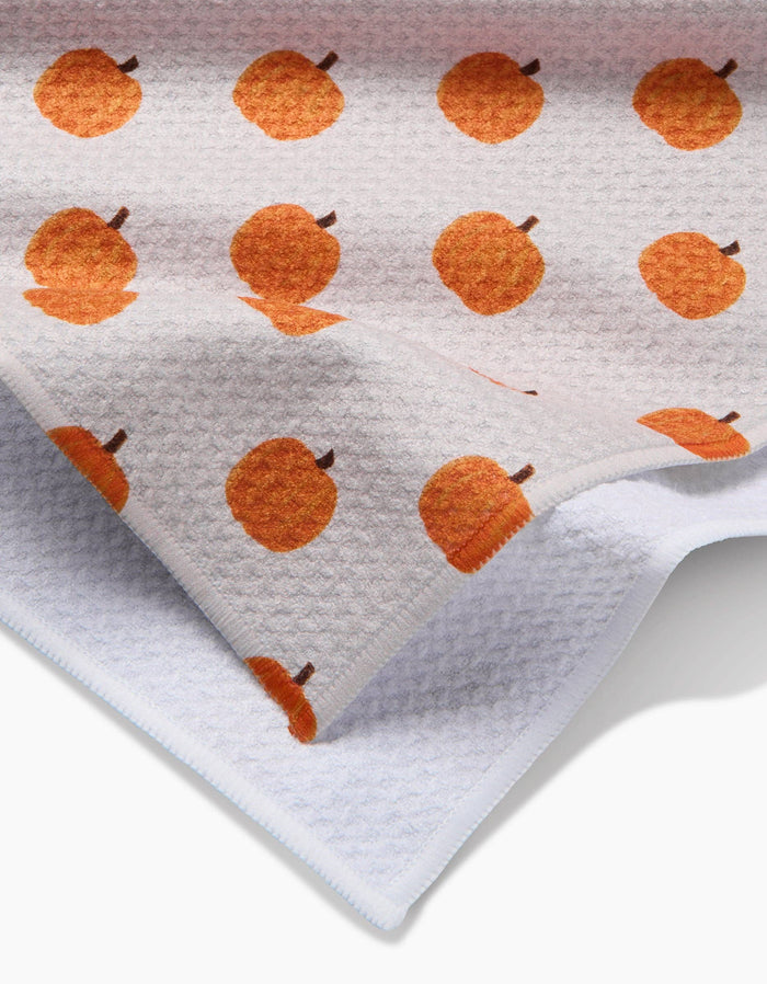 Towel with orange pumpkin pattern on a white background