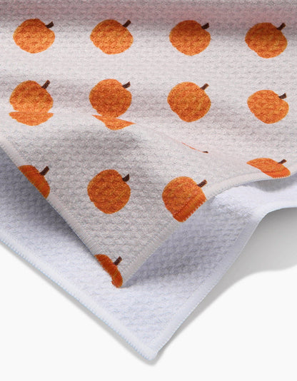 Towel with orange pumpkin pattern on a white background