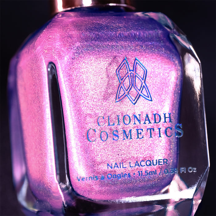 Close-up, angled shot of P.B. and Holo Nail Lacquer bottle on a black background.