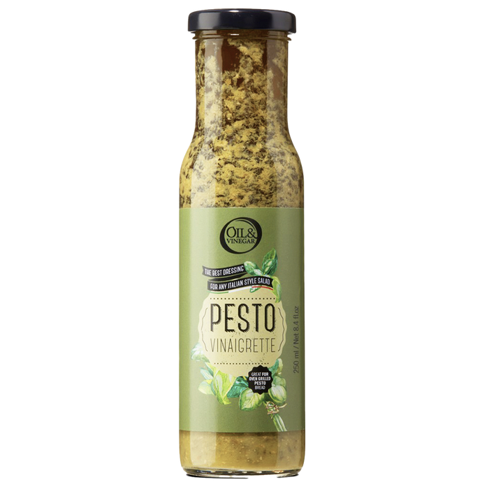 A bottle of Pesto Vinaigrette with a label showing the product name and a brief description.