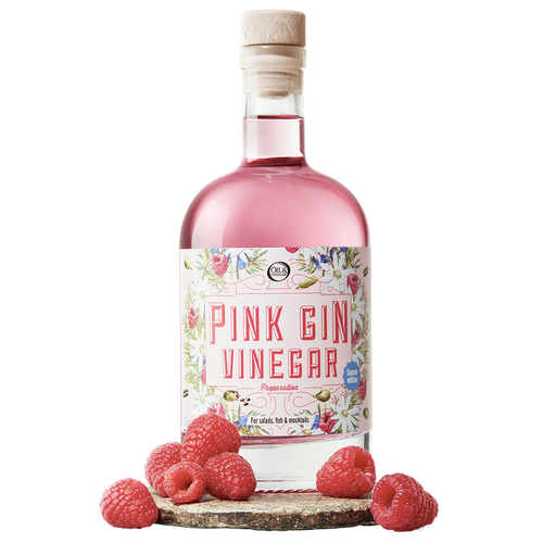 A bottle labeled 'Pink Gin Vinegar' with a pink liquid visible through the clear glass. The bottle is adorned with a label featuring botanical illustrations and has a cork closure.