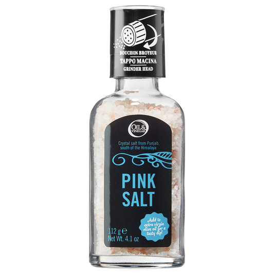 A glass bottle of pink salt with a grinder cap, labeled and including product information.