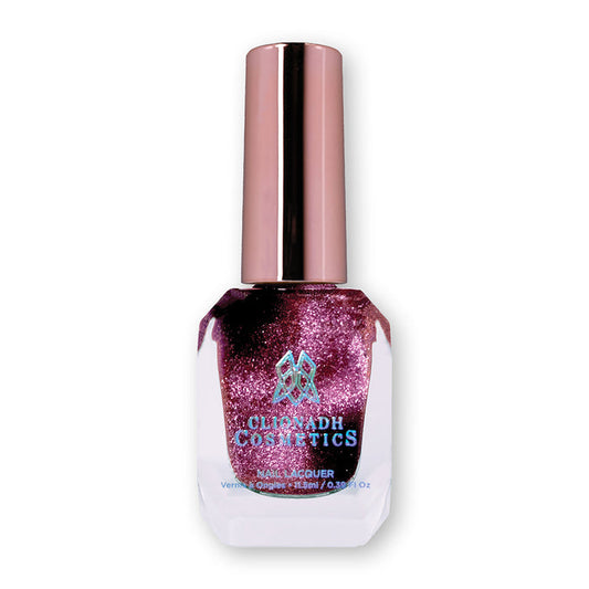 Bottle of nail polish containing Plush Pink Nail Laquer on white background.