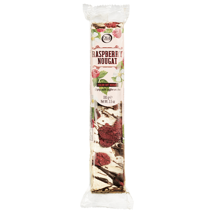Packaged raspberry nougat bar visible through the transparent window of the packaging, with the brand and product name displayed.