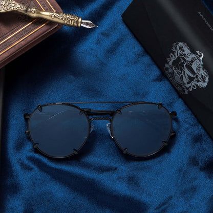 Flat-lay of Harry Potter x DIFF Ravenclaw  sunglasses lying folded on top of blue fabric in front of tri-fold case