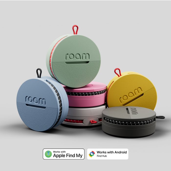 Colorful 'roam' keyfinders stacked on a light gray background