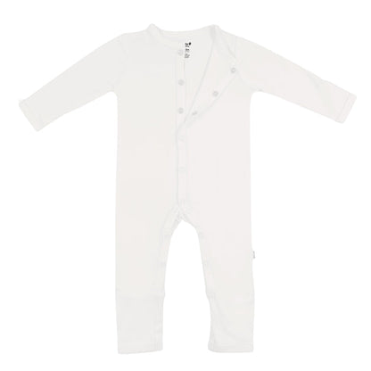 Flat lay of Kyte Baby long sleeve Romper in Cloud with top snaps opened