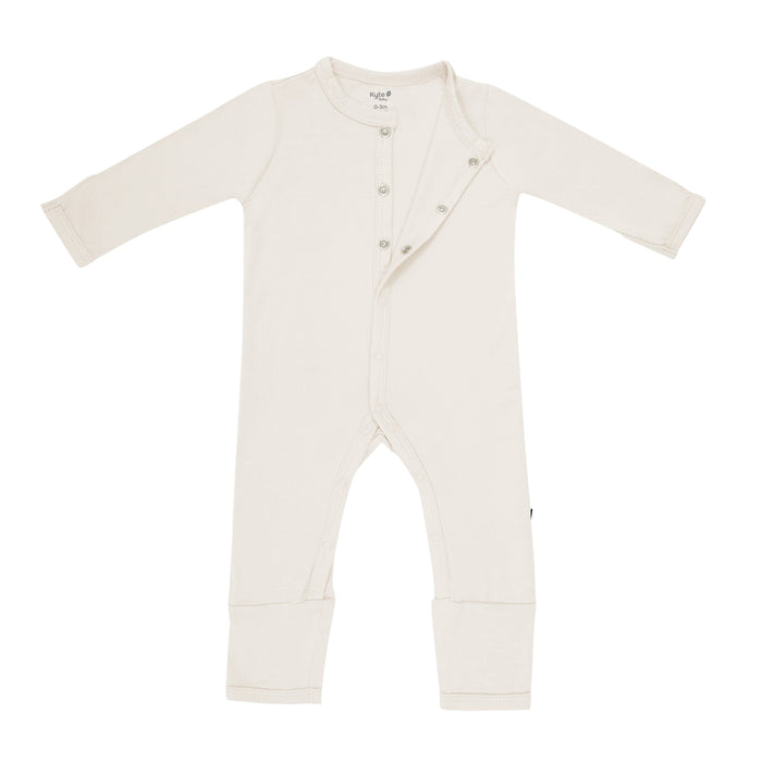 Kyte Baby Snap Romper in Oat unsnapped from the top