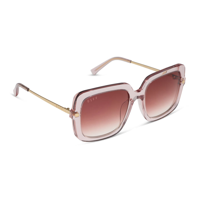 diff eyewear sandra square sunglasses with a light pink crystal frame and peach dusk gradient lenses angled view