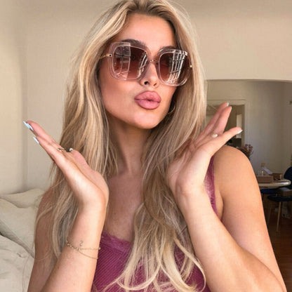 lifestyle - shelby hunstad wearing diff eyewear oversized pink sunglasses indoors