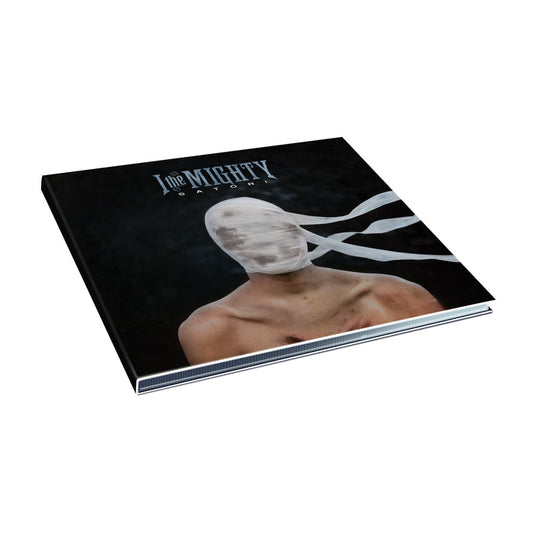 A square album cover from I The Mighty shows a shirtless figure with their head wrapped in white bandages, face hidden. Set against a dark background, it features the band name and Satori at the top, making for an intriguing CD release.