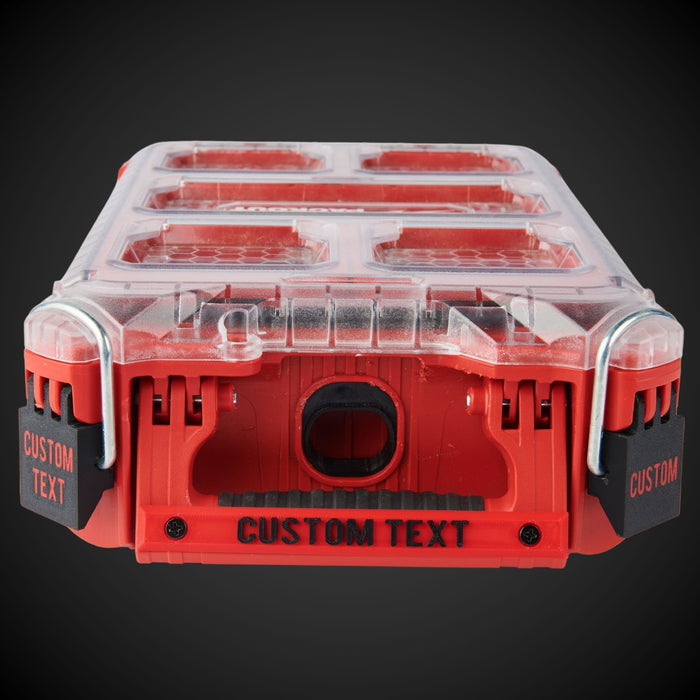 Red milwaukee organizer with customizable Screw_On_Label on a dark background