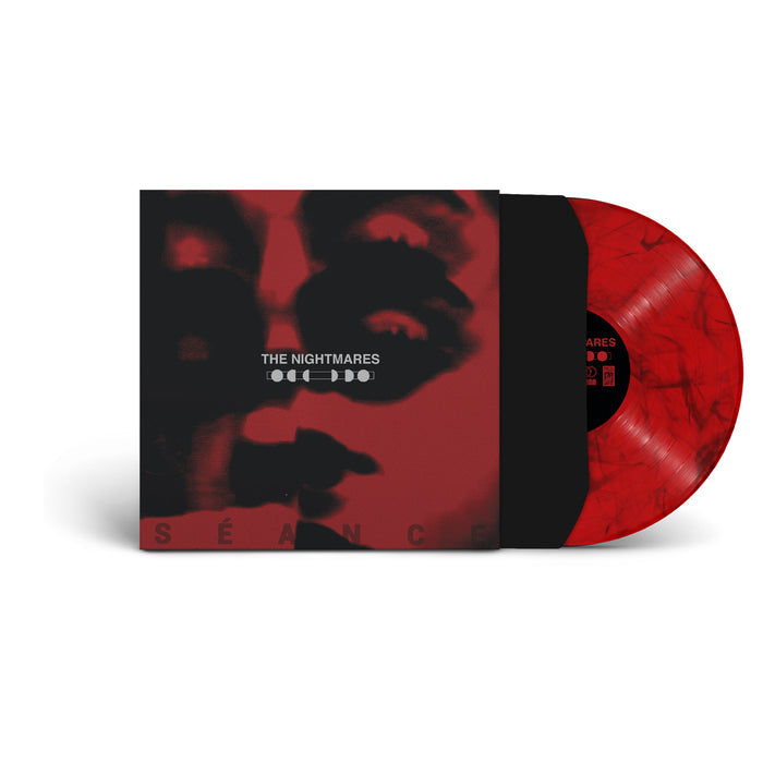 Vinyl cover with a distorted face on it and text dead center that Reads the nightmares.  The record is sticking out of the cover to show it is crimson red.