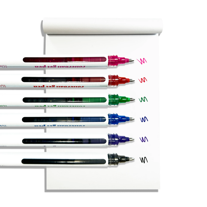 Row of uncapped OOLY Seriously Smooth Rollerball Gel Pens with color swatches on a white notepad on a white background