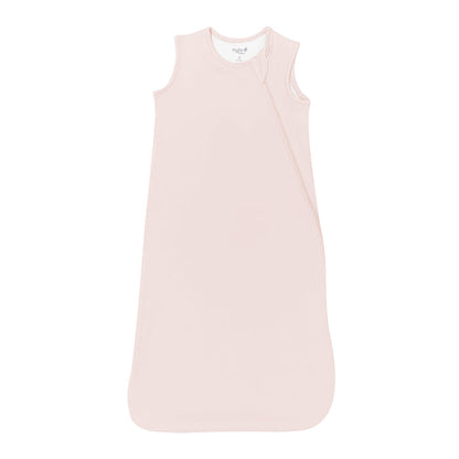 Flat lay photo of a Kyte Baby Sleep Bag in Blush 0.5