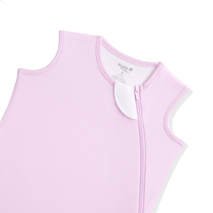Light purple sleeveless baby sleep bag with a zipper on a white background
