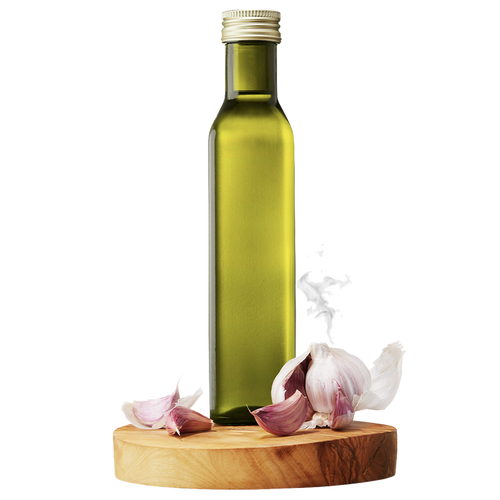 A bottle of Smoky Garlic Grapeseed Oil displayed on a wooden platform with whole garlic cloves and sliced garlic nearby.