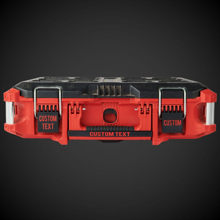 Red and black tool organizer with customizable text on a dark background