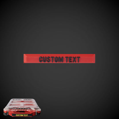 A custom Snap On Label - Low Half Width Organiser with a red background and black text, designed to clip onto a packout handle.