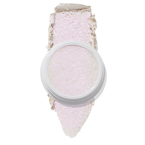 ColourPop Spellbound Super Shock Highlighter in a white pot, displaying an iridescent pink-lilac glow, with a broad swatch stroke beneath the pan showing its soft, shimmery payoff on a clean white background.