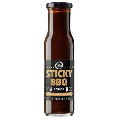 A bottle of Sticky BBQ Sauce with a label showing the product name and volume.