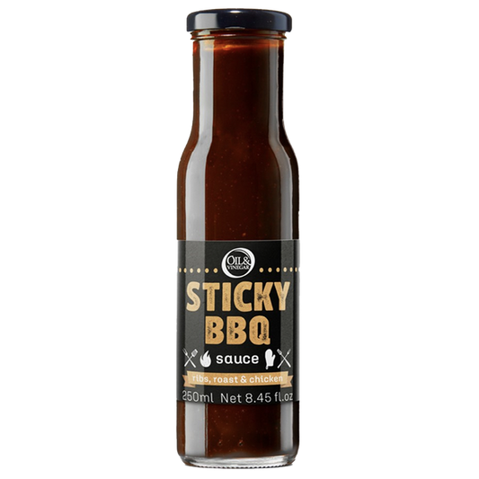 A bottle of Sticky BBQ Sauce with a label showing the product name and volume.