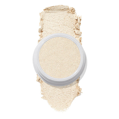 ColourPop Stole the Show Super Shock Highlighter in a round white pot sits atop a thick champagne‑pearl swatch on a white background, showing its luminous shimmer finish for face highlighting.