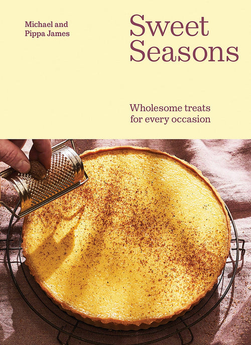 Book cover of 'Sweet Seasons' with a pie being grated on a light background
