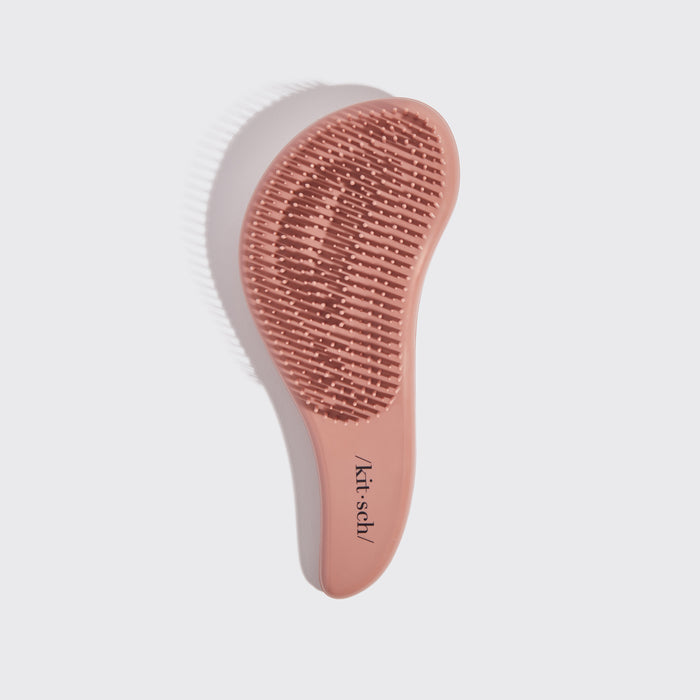 Kitsch Terracotta Detangling Brush angled view showing bristle base