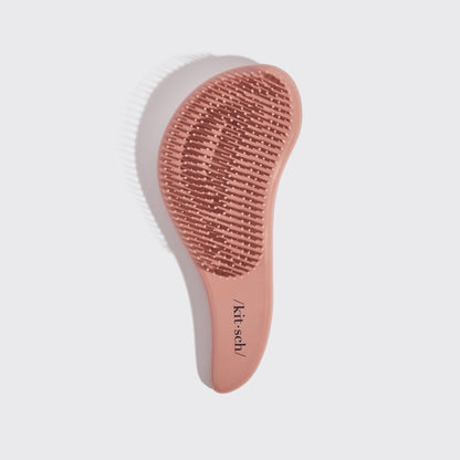 Kitsch Terracotta Detangling Brush angled view showing bristle base