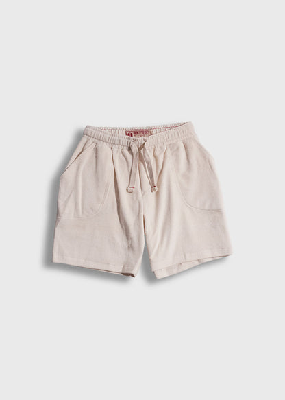 Beige drawstring shorts with front pockets, displayed on a white background, showcasing casual style and comfort.