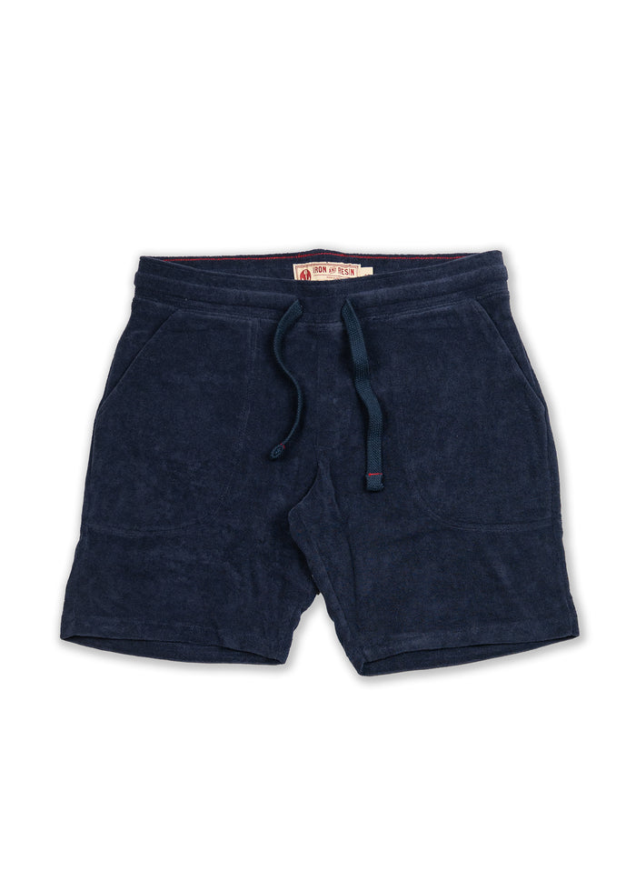 Navy blue terry cloth shorts with drawstring waistband and side pockets, labeled "Iron and Resin" inside.