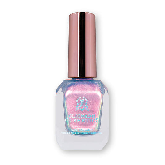 Bottle of nail polish containing Tessera Nail Laquer on white background.