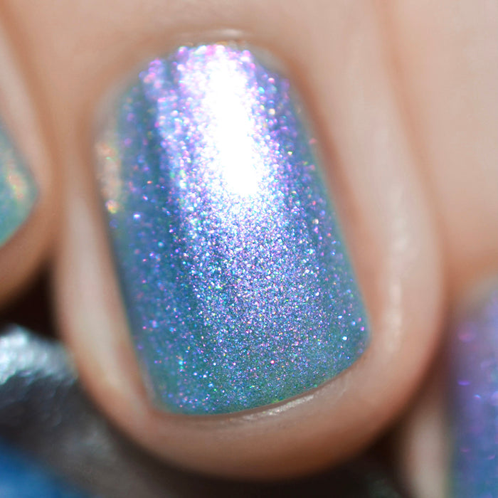 Close-up of one nail painted with Tessera Nail Lacquer on fair skin tone.