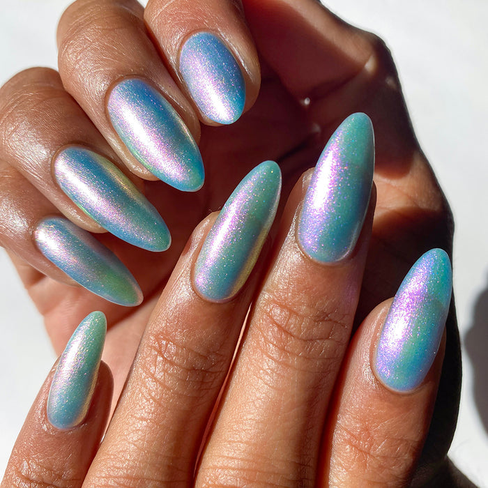 Nails painted with Tessera Nail Lacquer on medium skin tone.