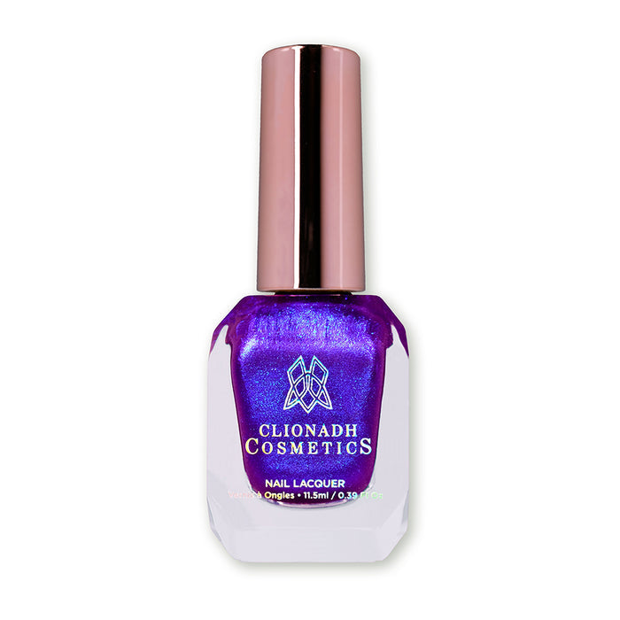 Bottle of nail polish containing Tiara Nail Laquer on white background.